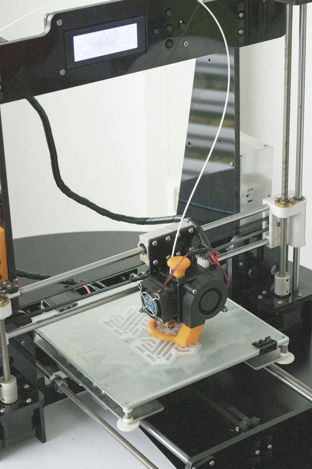 FDM 3D printer printing a plastic part